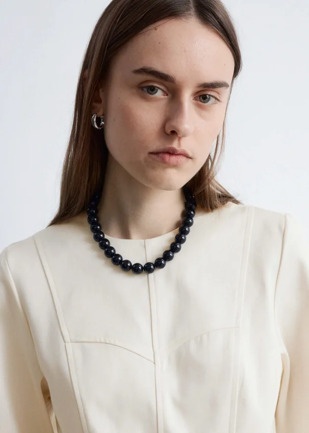 Baumwoll-Peplum-Oberteil Baumwoll-Peplum-Oberteil