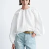 Bluse aus Baumwollpopeline mit Reißverschluss vorne Bluse aus Baumwollpopeline mit Reißverschluss vorne
