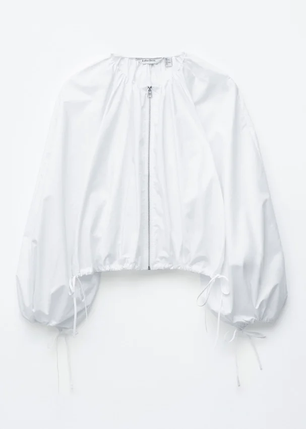 Bluse aus Baumwollpopeline mit Reißverschluss vorne Bluse aus Baumwollpopeline mit Reißverschluss vorne