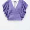 Bluse mit Rüschen und V-Ausschnitt Bluse mit Rüschen und V-Ausschnitt