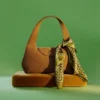 Geschwungene Schultertasche Geschwungene Schultertasche