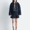 Kurze Jeansjacke mit Cordkragen Kurze Jeansjacke mit Cordkragen