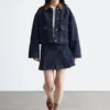 Kurze Jeansjacke mit Cordkragen Kurze Jeansjacke mit Cordkragen