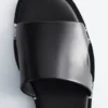 Leder-Pantoletten mit Metallverzierung