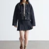 Plissierter Denim-Minirock Plissierter Denim-Minirock