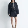 Plissierter Denim-Minirock Plissierter Denim-Minirock