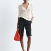 Polo-Shirt aus offenem Strick Polo-Shirt aus offenem Strick