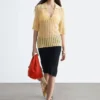 Polo-Shirt aus offenem Strick Polo-Shirt aus offenem Strick