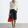 Polo-Shirt aus offenem Strick Polo-Shirt aus offenem Strick