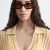 Polo-Shirt aus offenem Strick Polo-Shirt aus offenem Strick