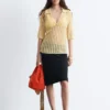 Polo-Shirt aus offenem Strick Polo-Shirt aus offenem Strick