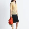 Polo-Shirt aus offenem Strick Polo-Shirt aus offenem Strick