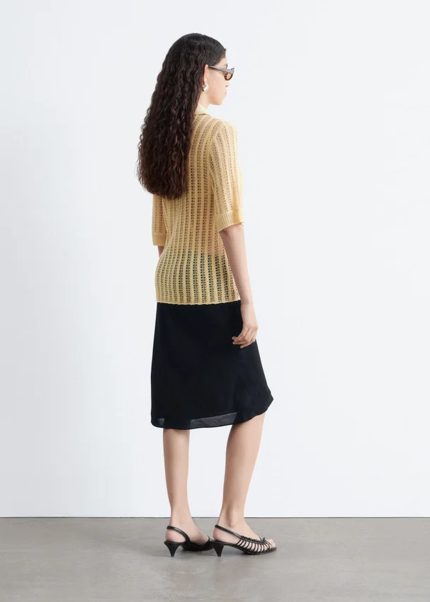 Polo-Shirt aus offenem Strick Polo-Shirt aus offenem Strick