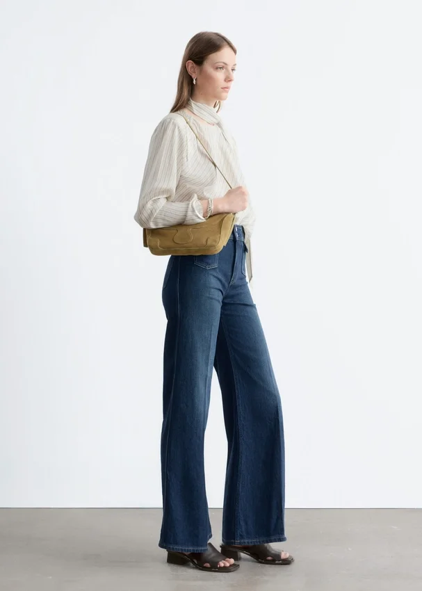 Press-Crease-Jeans mit ausgestelltem Bein Press-Crease-Jeans mit ausgestelltem Bein