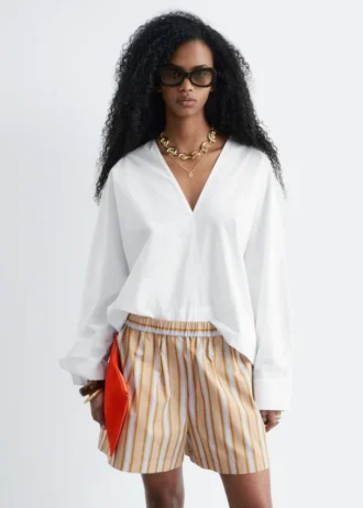 Skulpturale Baumwoll-V-Ausschnitt-Bluse Skulpturale Baumwoll-V-Ausschnitt-Bluse