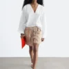 Skulpturale Baumwoll-V-Ausschnitt-Bluse Skulpturale Baumwoll-V-Ausschnitt-Bluse