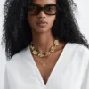 Skulpturale Baumwoll-V-Ausschnitt-Bluse Skulpturale Baumwoll-V-Ausschnitt-Bluse