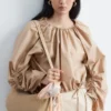 Skulpturale Bluse mit Kordelzug Skulpturale Bluse mit Kordelzug