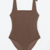 Strandkleid mit strukturierter Schleife Strandkleid mit strukturierter Schleife