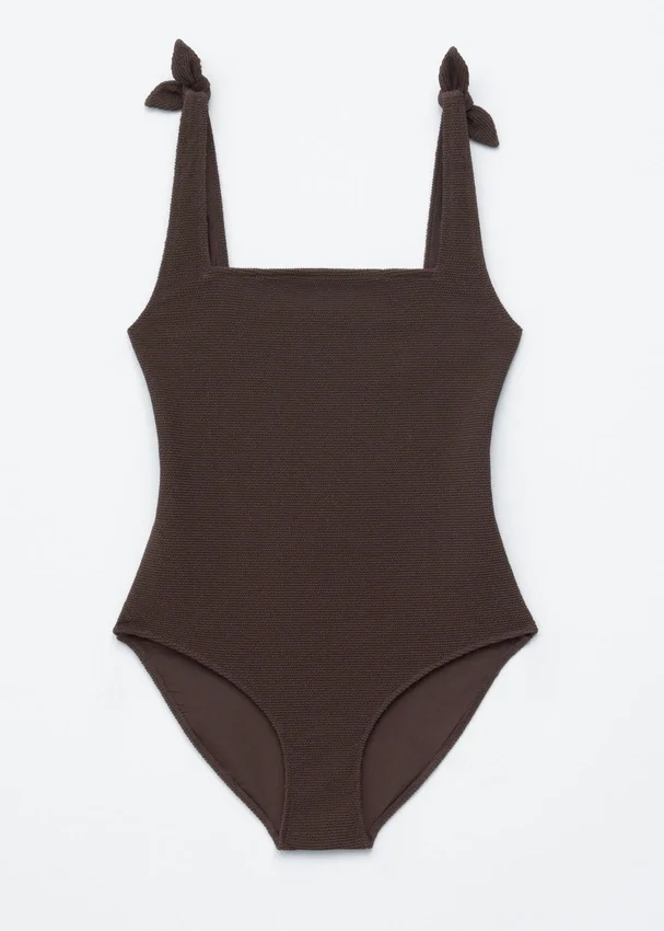 Strandkleid mit strukturierter Schleife Strandkleid mit strukturierter Schleife