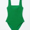 Strandkleid mit strukturierter Schleife Strandkleid mit strukturierter Schleife
