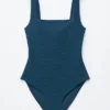 Strandkleid mit strukturierter Schleife Strandkleid mit strukturierter Schleife