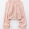 Voluminöse Bluse mit Bindedetails Voluminöse Bluse mit Bindedetails